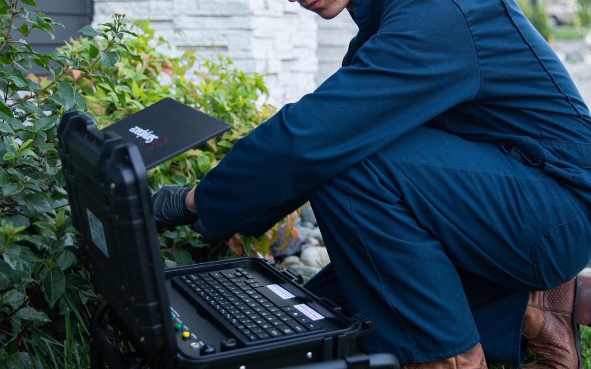 Sam Belza preparing residential sewer scope camera equipment
